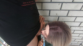 Cumshot in the mouth behind the garages