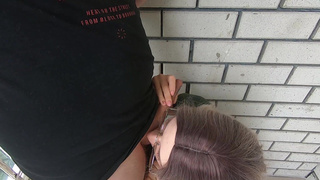 Cumshot in the mouth behind the garages