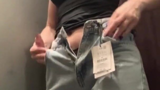 Hot MILF masturbates in the fitting room of the store